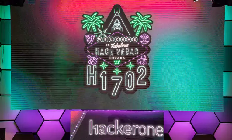 H1-702 logo