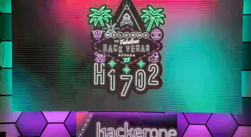 H1-702 logo